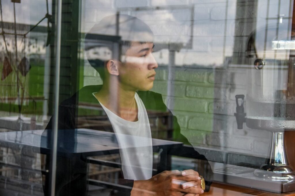 "Person in quiet self-reflection representing the inner work of examining emotional states and where energy is being directed"
